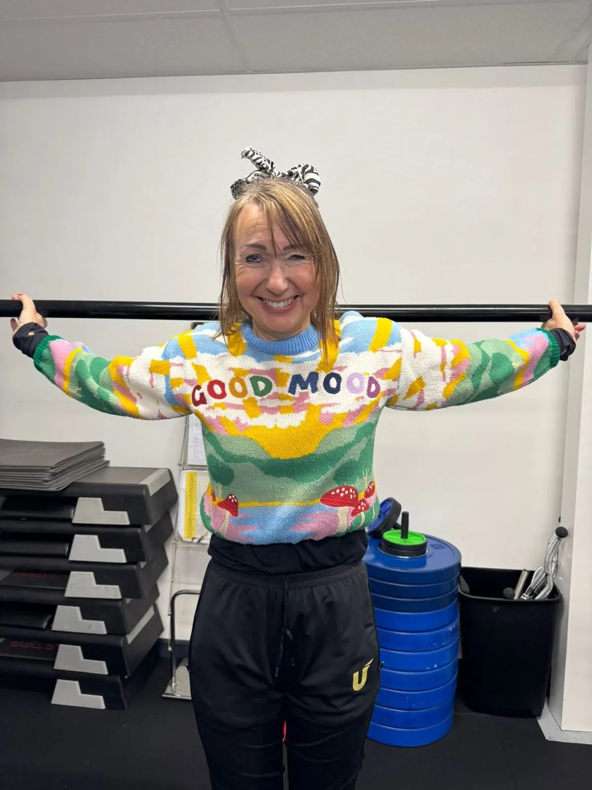 Members in a colourful Universal Fitness top