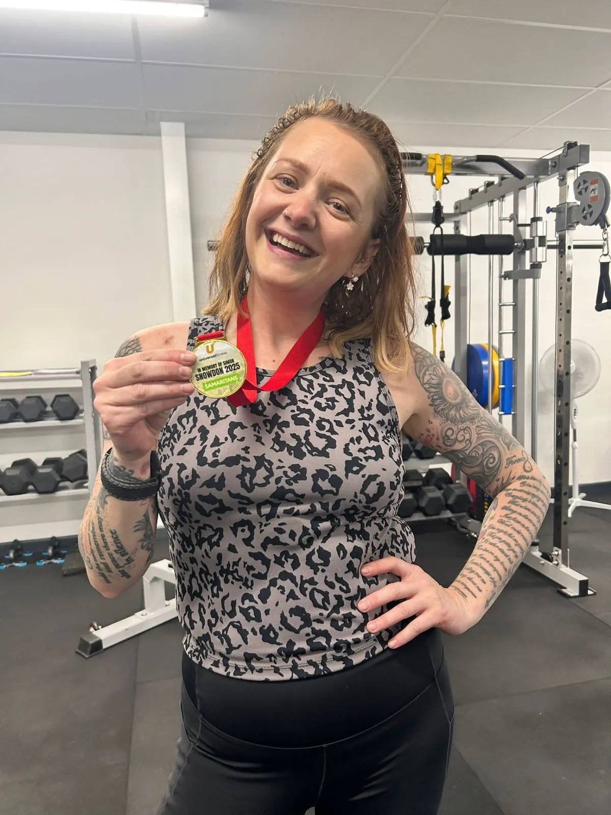 Smiling member after a session at Universal Fitness